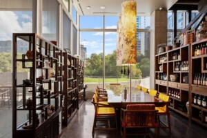 Private dining room with traditional Chinese shelving teapots wine storage and floor-to-ceiling